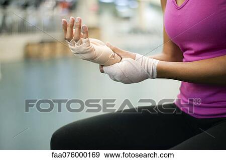 Stock Photo - Woman with bandaged hands, cropped. Fotosearch