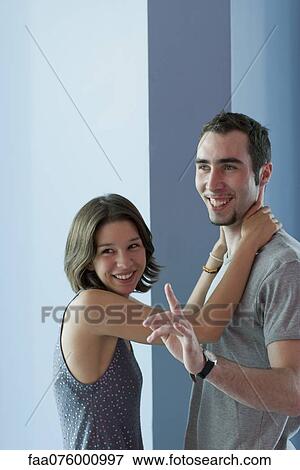 Stock Photo - Young couple hanging out together. Fotosearch