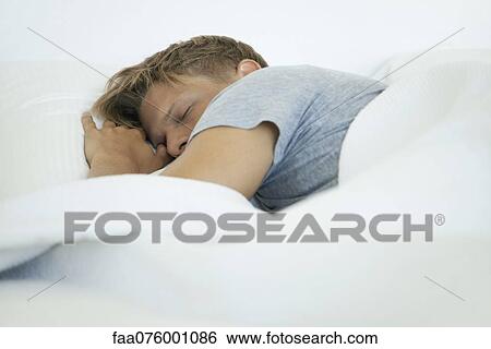 Stock Photograph - Young man sleeping. Fotosearch