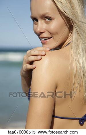 Stock Photography - Young woman in bikini, cropped. Fotosearch