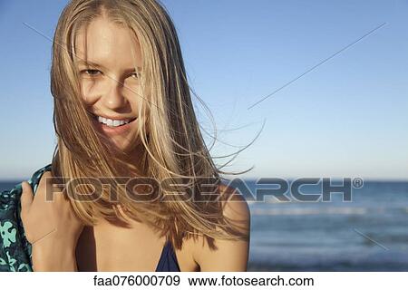 Stock Photo - Young woman in bikini, portrait. Fotosearch