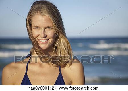 Stock Photo - Young woman in bikini, portrait. Fotosearch