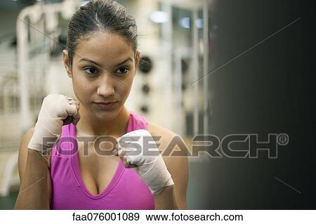 Young woman in fighting stance View Large Photo Image Stock Photo - Young woman in fighting stance. Fotosearch