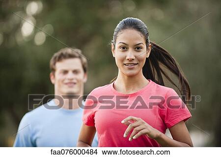 Picture - Young woman jogging. Fotosearch
