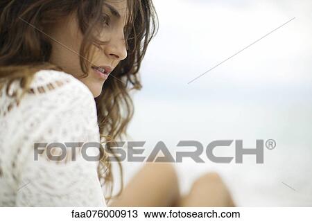 Stock Image - Young woman outdoors, cropped. Fotosearch