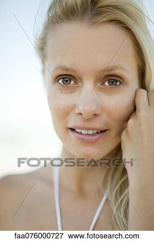 Young woman outdoors, portrait View Large Photo Image Stock Photo - Young woman outdoors, portrait. Fotosearch