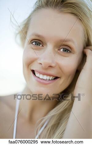 Stock Photography - Young woman outdoors, portrait. Fotosearch