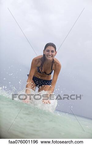 Stock Photograph - Young woman splashing water. Fotosearch