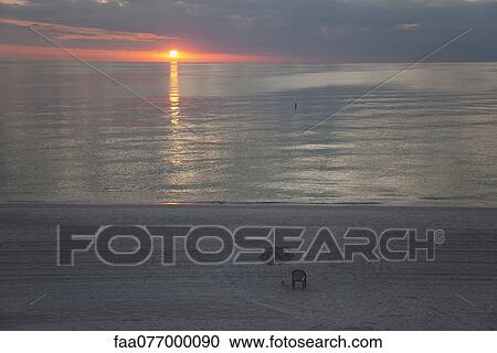 Beach at sunset View Large Photo Image Stock Image - Beach at sunset. Fotosearch
