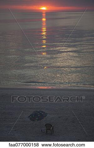 Stock Photo - Beach at sunset. Fotosearch