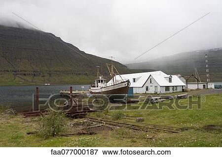 Boat drydocked in fishing village, Iceland View Large Photo Image Stock Photo - Boat drydocked in fishing village, Iceland. Fotosearch