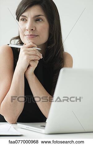 Stock Photo - Businesswoman in thought. Fotosearch