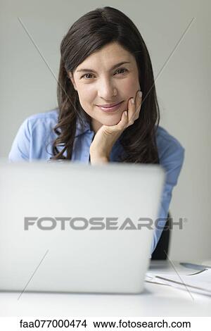 Businesswoman with laptop computer, portrait View Large Photo Image Picture - Businesswoman with laptop computer, portrait. Fotosearch