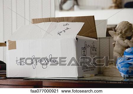 Cardboard moving box labeled "tres fragile" View Large Photo Image Stock Image - Cardboard moving box labeled "tres fragile". Fotosearch