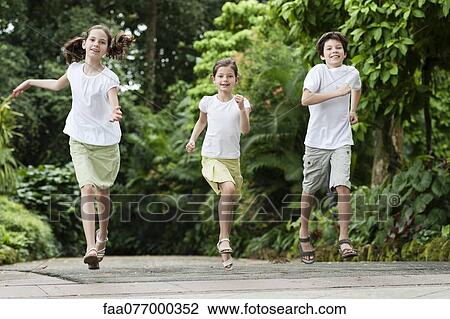 Stock Image - Children running outdoors. Fotosearch
