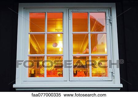 Stock Photography - Christmas decorations hanging in window. Fotosearch