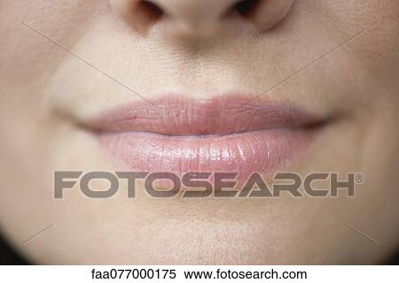 Stock Photography - Close up of woman's lips, cropped. Fotosearch
