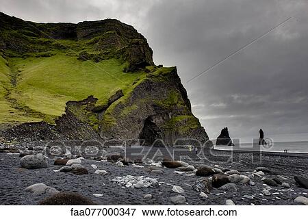 Stock Photo - Columnar basalt cave and black sand, Vik Beach, Vik, Iceland. Fotosearch