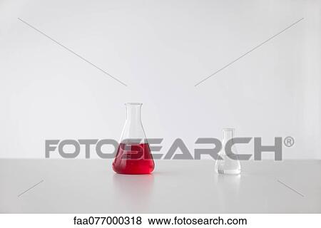 Conical flasks containing liquid View Large Photo Image Stock Photo - Conical flasks containing liquid. Fotosearch