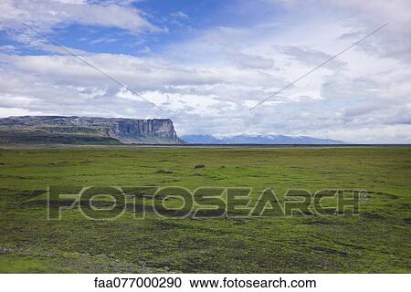 Countryside with cliffs in the distance, Iceland View Large Photo Image Stock Image - Countryside with cliffs in the distance, Iceland. Fotosearch