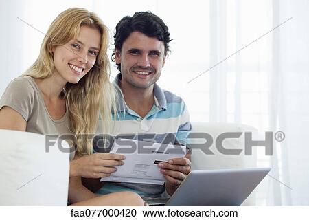 Couple paying bill online View Large Photo Image Stock Image - Couple paying bill online. Fotosearch