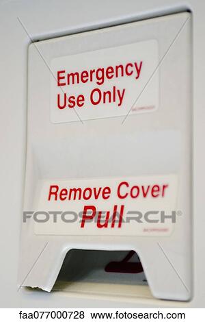 Emergency exit lever in airplane View Large Photo Image Stock Photo - Emergency exit lever in airplane. Fotosearch