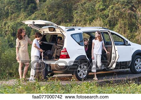 Family with SUV exploring the outdoors View Large Photo Image Stock Image - Family with SUV exploring the outdoors. Fotosearch