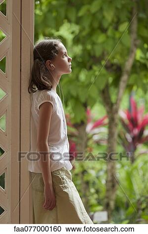 Girl listening to music with earphones View Large Photo Image Stock Image - Girl listening to music with earphones. Fotosearch