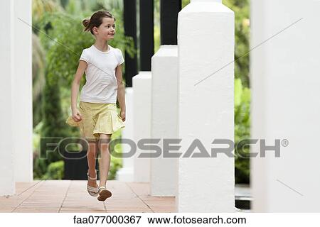 Girl running outdoors View Large Photo Image Stock Photo - Girl running outdoors. Fotosearch