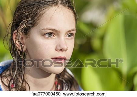 Girl with wet hair looking away in interest View Large Photo Image Stock Image - Girl with wet hair looking away in interest. Fotosearch
