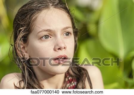 Girl with wet hair looking away with surprised expression on face View Large Photo Image Stock Image - Girl with wet hair looking away with surprised expression on face. Fotosearch