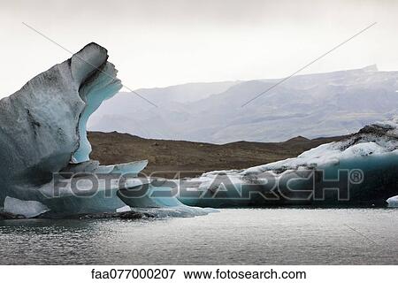 Stock Photo - Icebergs in Jokulsarlon glacial lagoon, Iceland. Fotosearch
