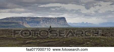 Iceland, panoramic view of lava field and cliffs View Large Photo Image Stock Image - Iceland, panoramic view of lava field and cliffs. Fotosearch