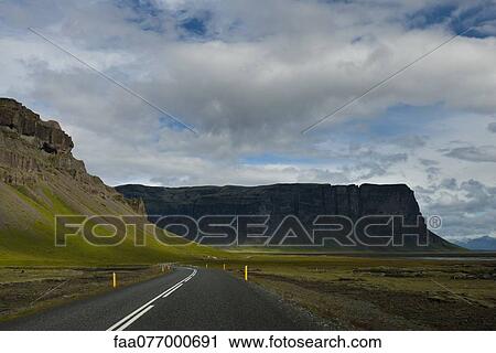 Iceland, road running along cliffs View Large Photo Image Stock Image - Iceland, road running along cliffs. Fotosearch