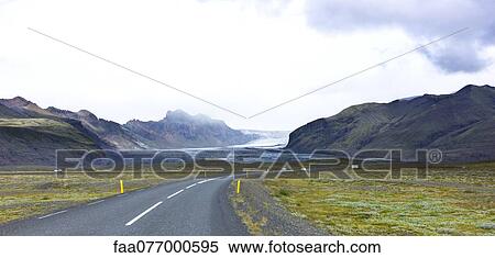 Stock Photography - Iceland, road running along glacier. Fotosearch
