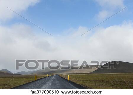 Stock Image - Iceland, road through barren countryside. Fotosearch