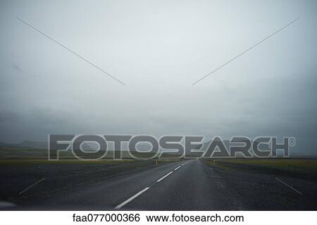 Iceland, road through foggy countryside View Large Photo Image Stock Photograph - Iceland, road through foggy countryside. Fotosearch