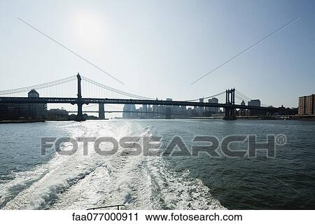 Manhattan Bridge and East River, New York City, New York, USA View Large Photo Image Stock Image - Manhattan Bridge and East River, New York City, New York, USA. Fotosearch