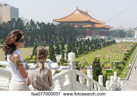 Mother and daughter reading guidebook at Chiang Kai-shek Memorial Hall, Taipei, Taiwan View Large Photo Image Stock Photo - Mother and daughter reading guidebook at Chiang Kai-shek Memorial Hall, Taipei, Taiwan. Fotosearch