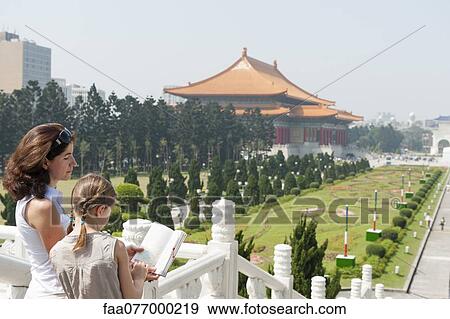 Mother and daughter reading guidebook at Chiang Kai-shek Memorial Hall, Taipei, Taiwan View Large Photo Image Stock Photo - Mother and daughter reading guidebook at Chiang Kai-shek Memorial Hall, Taipei, Taiwan. Fotosearch