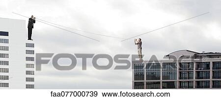 Oversized men standing on rooftops, talking to each other through tin can phones View Large Photo Image Stock Photo - Oversized men standing on rooftops, talking to each other through tin can phones. Fotosearch