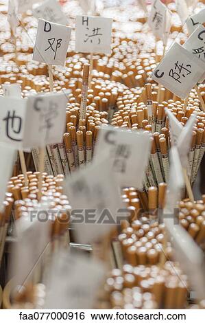 Stock Photograph - Personalized chopsticks bearing common surnames for sale in shop. Fotosearch