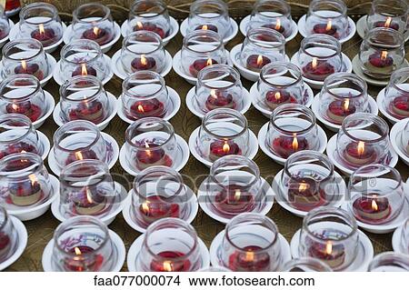 Picture - Prayer candles in temple. Fotosearch