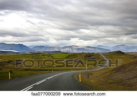 Road winding through mountain landscape, Iceland View Large Photo Image Stock Photo - Road winding through mountain landscape, Iceland. Fotosearch