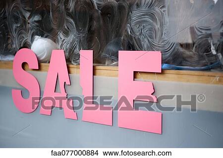 Picture - Sale sign on shop window. Fotosearch