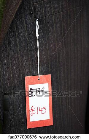 Stock Photograph - Sale tag on clothing. Fotosearch