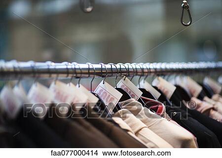 Picture - Sale tags on clothing in store, cropped. Fotosearch