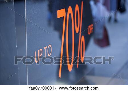Sign in shop window advertising seventy percent off sale View Large Photo Image Stock Photo - Sign in shop window advertising seventy percent off sale. Fotosearch