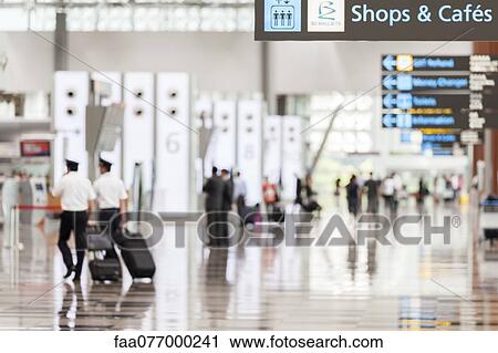 Stock Image - Signs in airport concourse. Fotosearch