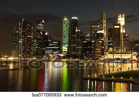 Stock Image - Singapore, waterfront skyline viewed from esplanade at night. Fotosearch
